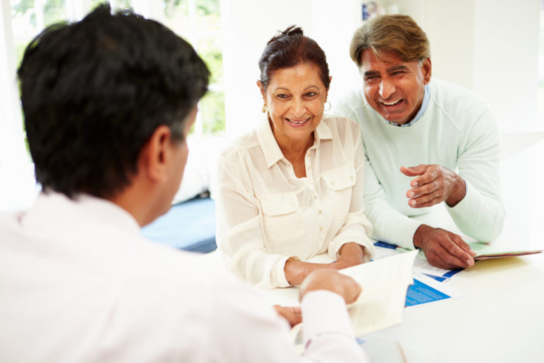 couple laughing at a brochure